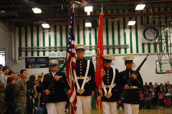 The ROTC marches after presenting the flags at a pep assembly.