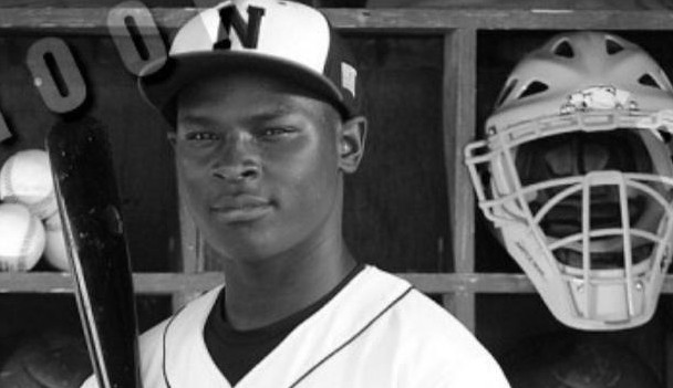Senior Kalob Russell posing for North Highs spring baseball pictures