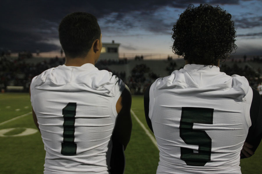 Caleb Lara #1 standing on the sidelines with Trey Warrick #5, during the North/East game Sept, 5, 2014