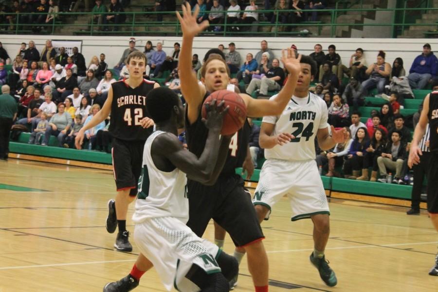 North boys basketball wins over rival East