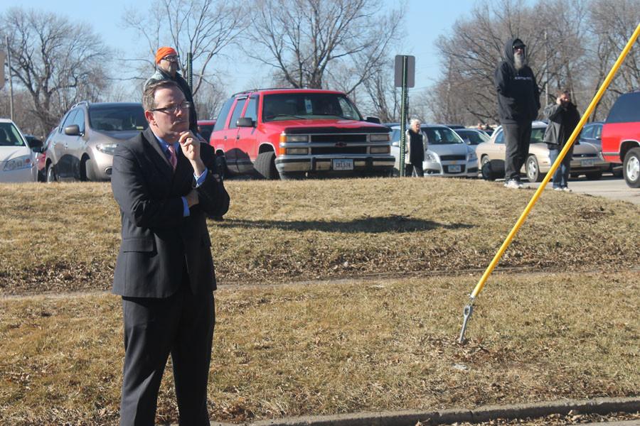 Matt Smith, a DMPS employee stands with a watchful eye over his students