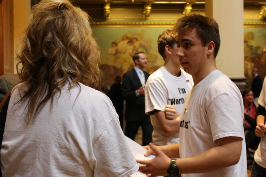Anthony Desalvo, a sophomore at Davenport Central, the leader of the Worth-Less movement talks with one of his classmates