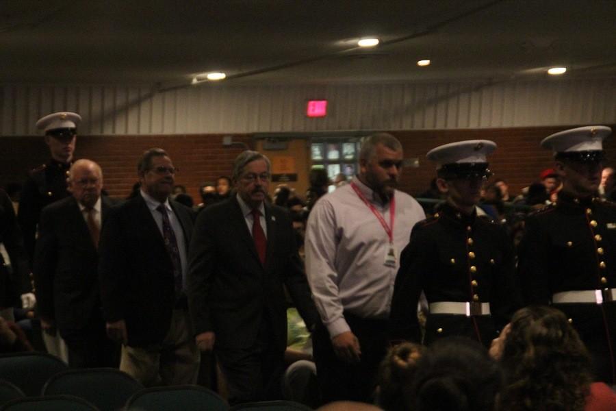Principal Michael Vukovich and Governor Branstad file in for the 2015 Veterans Day Assembly at North High, Nov. 12.
