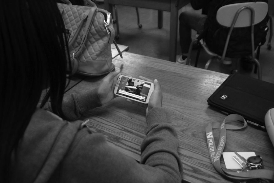 Eleventh grade student Amirah Avant watches the shocking video of the infamous incident. Photo Credit: Angelica Reyes