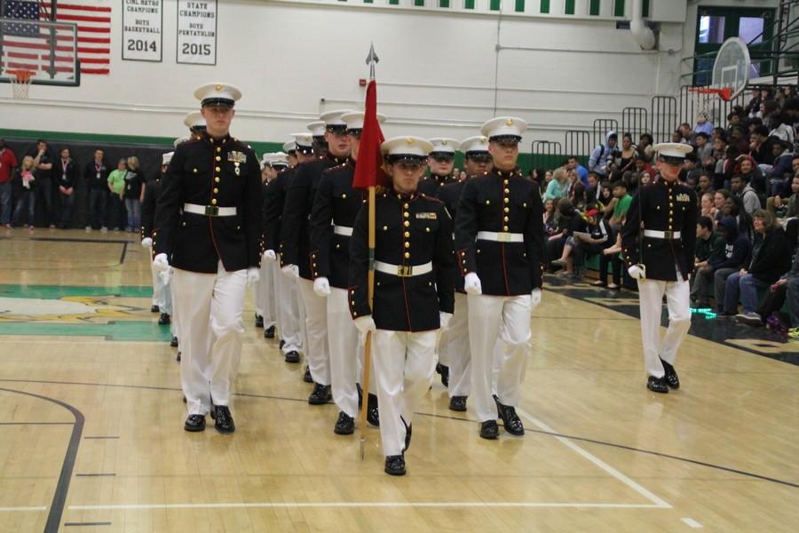 The drill team marched across the gym during the pep rally. 