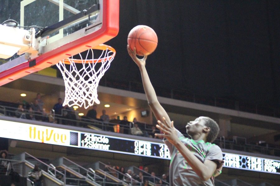 Jal Bijiek gets right up to the rim scoring for the North High Bears. 
