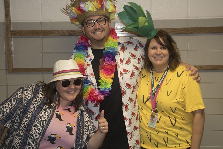 Amy and Jeff Rost pose with Lori Bonstetter for Tropical Tuesday.